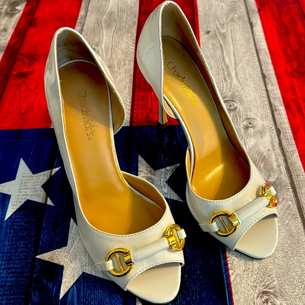 Nautical white patent leather pumps with cut out side.